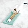Alfombra de silicona resistente al calor, diseñada para proteger las superficies de sus muebles del daño por planchas de cabello