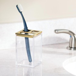 Este soporte para cepillo de dientes presenta dos aberturas pequeñas y una más grande, puede contener hasta cuatro cepillos de d