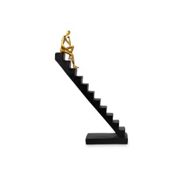 El accesorio decorativo Escalera con Hombre representa el esfuerzo, la superación y el deseo constante de alcanzar nuevas altura