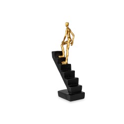El accesorio decorativo Escalera con Hombre representa el esfuerzo, la superación y el deseo constante de alcanzar nuevas altura