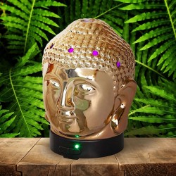 El difusor ultrasónico combina el poder de la aromaterapia con el diseño elegante de una cabeza de Buda en cerámica dorada, idea