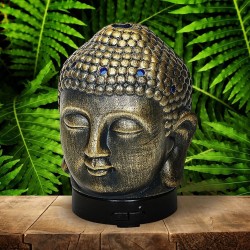 El difusor ultrasónico combina el poder de la aromaterapia con el diseño elegante de una cabeza de Buda en cerámica dorada, idea