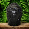 El difusor ultrasónico combina el poder de la aromaterapia con el diseño elegante de una cabeza de Buda en cerámica dorada, idea