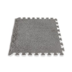 Agrega dinamismo y personalidad a tus espacios con el Tapete Decorativo Puzzle. Su diseño entrelazado tipo rompecabezas no solo 