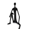 Agrega profundidad y estilo a tu decoración con esta escultura del "Hombre Pensante". Su silueta moderna y minimalista transmite