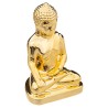 Figura decorativa de buda con un acabado dorado brillante y elegante. Su diseño armonioso añade un toque espiritual y cómodo a c
