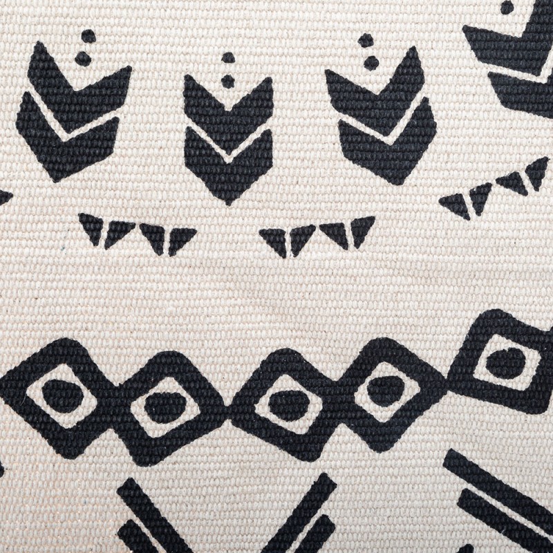 Encerrada por un fino borde de flecos, esta alfombra de algodón presenta motivos geométricos organizados en círculos concéntrico