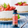 Una fragancia deliciosa que huele a una rebanada cremosa de tarta de queso con salsa de fresa casera. Su dulce aroma envolvente 