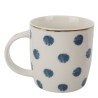 Disfruta de tus bebidas favoritas con esta taza decorada con un moderno patrón de círculos. Perfecta para un toque único en tu d